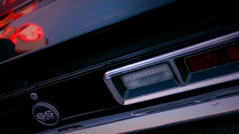 Classic black Camaro SS tail lights in the evening Stock Footage 89954128
