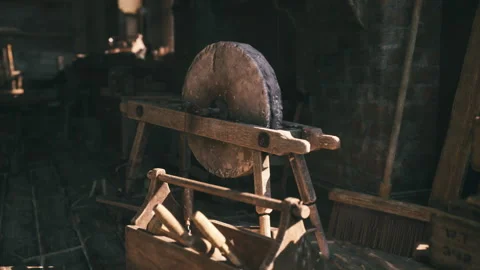 Classic bladesmith setup featuring aged tools and warm lamp glow Stock Footage 331531129