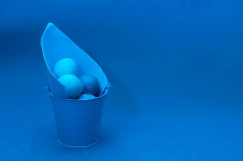 Classic blue easter eggs in bucket Stock Photos