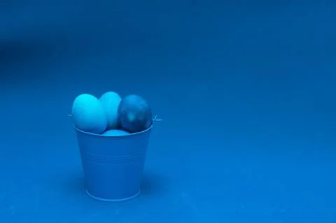 Classic blue easter eggs in bucket Stock Photos