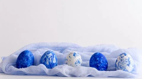 Classic blue eggs with gradient effect for Easter on white background Stock Photos