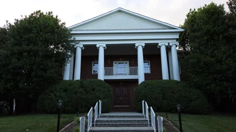 Classic brick building with white columns Stock Footage 337796859