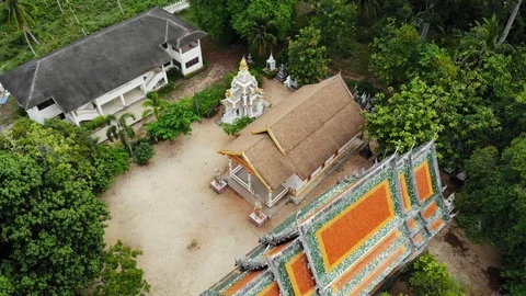 Classic Buddhist temple between forest. From above drone view classic Buddhist Stock Footage 116995471