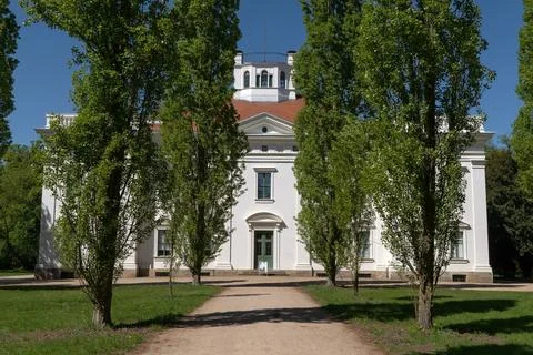 Classic building in the park in spring. Fotos de archivo