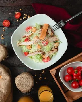Classic caesar salad with crispy crackers Stock Photos