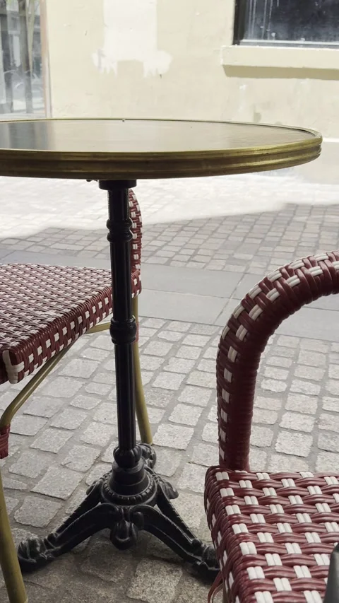 Classic Café Table with Red Wicker Chairs on European Street Vertical Stock Footage 340188261