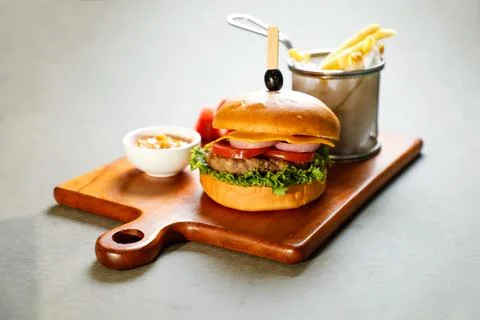 Classic Cajun Beef burger include cheese slice, tomato, onion and lettuce l.. Foto stock