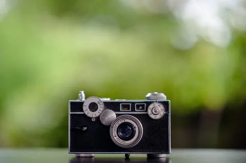 Classic camera Put on the table does not look expensive. Photography Ideas an Stock Photos