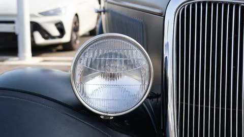 Classic Car Front With Round Headlight And Chrome Grille Stock Photos