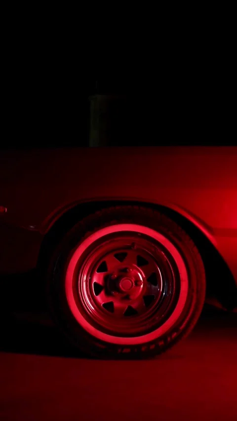 Classic car wheel with white wall tire red light Stock Footage 331771903