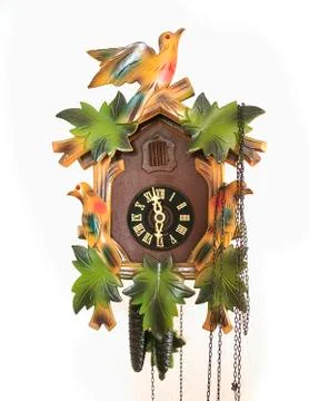 Classic Cukoo clock  on a white wall Stock Photos