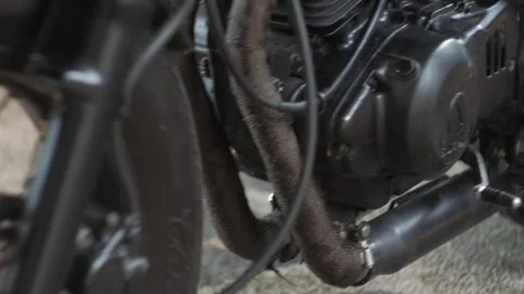 Classic custom motorcycle is moved backward after washing. The steady shot Stock Footage 242254417