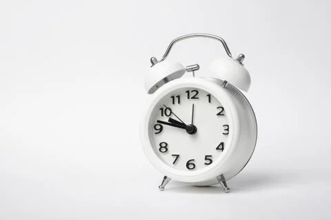Classic designed white colored table clock Stock Photos