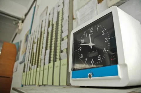 Classic digital clocking system in a factory Stock Photos