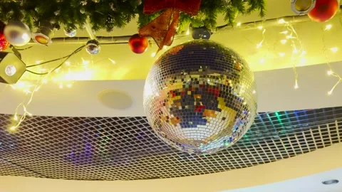Classic disco ball charm, festive lighting brilliance, warm golden hues, stylish Stock Footage 313210962