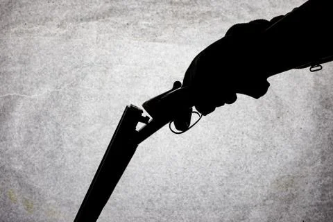 Classic double-barrell smooth-bore hunting rifle on man hand isolated on ligh Stock Photos