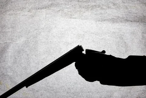 Classic double-barrell smooth-bore hunting rifle on man hand isolated on ligh Stock Photos
