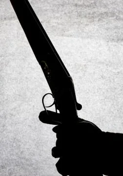 Classic double-barrell smooth-bore hunting rifle on man hand isolated on ligh Stock Photos