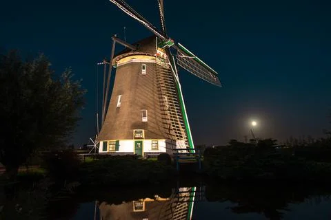 Classic Dutch Windmill with Moon Stock Photos