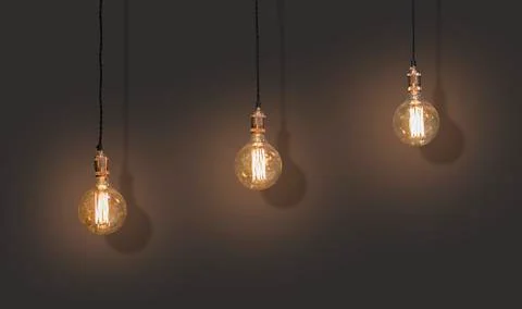 A classic Edison lights bulb isolated on black background with space. Stock Photos