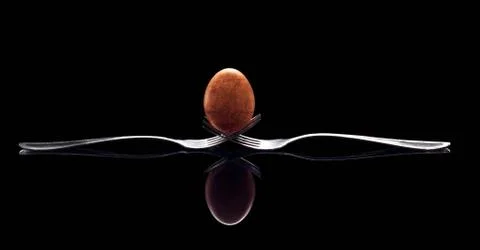 The classic egg on forks Stock Photos