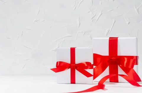 Classic elegant festive congratulation background with white gift boxes with  Stock Photos