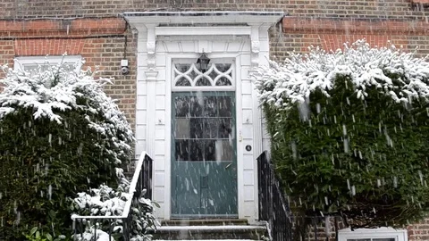 Classic English door in the snow. Stock Footage