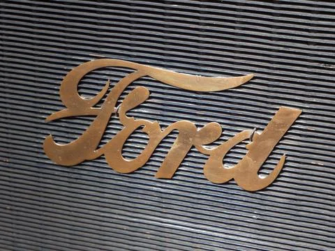 Classic Ford Model T (Year 1910) Logo on Textured Background Stock Photos
