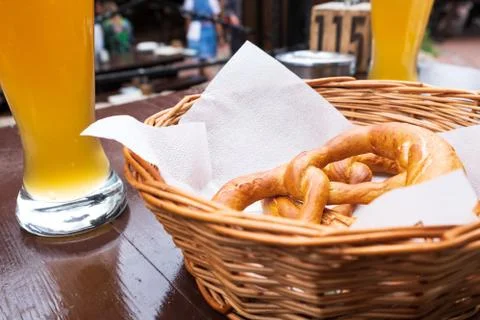 Classic German snacks beer on a table and bagel on a white plate 스톡 사진