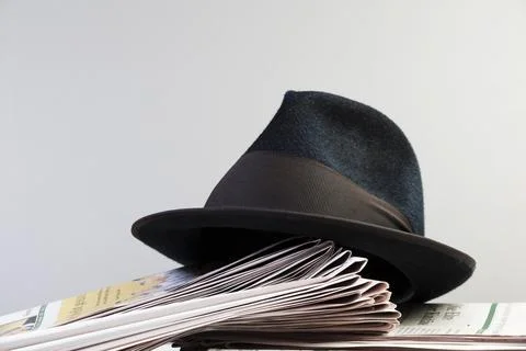 Classic hat on a newspaper Stock Photos