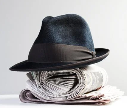 Classic hat on a newspaper Stock Photos