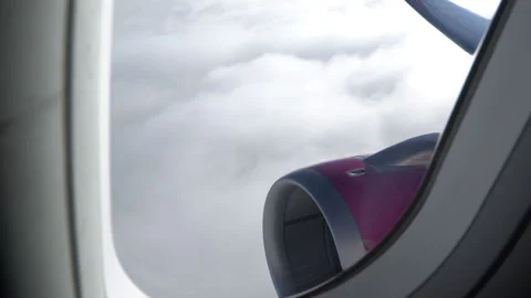 Classic image through aircraft window onto jet engine Stock Footage 92995231