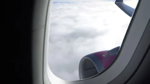 Classic image through aircraft window onto jet engine Stock Footage 92995340