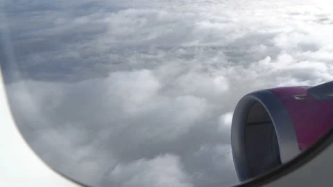 Classic image through aircraft window onto jet engine Stock Footage 92995518
