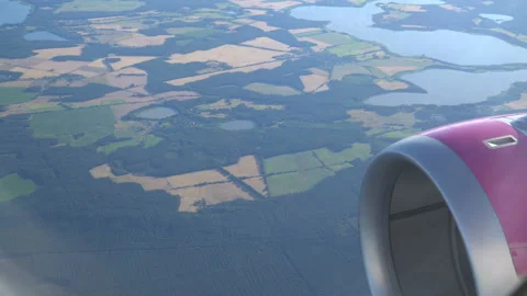 Classic image through aircraft window onto jet engine Stock Footage 92995646