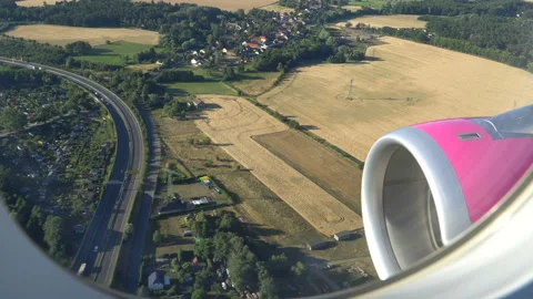 Classic image through aircraft window onto jet engine Stock Footage 92997155