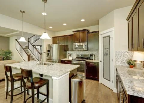 Classic kitchen room interior with large kitchen island with granite counter  Stock Photos