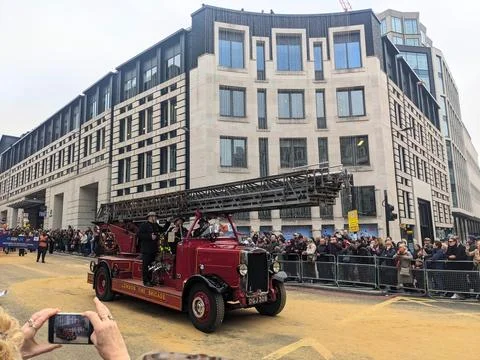 A classic London Fire Brigade engine parades past crowds during the annual Lady Stock Photos