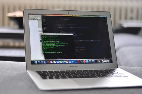 Classic Macbook Air with programming code on the screen 写真素材