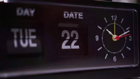 Classic mechanical flip clock with day, date flip cards and round analog face. Stock Footage 346222107