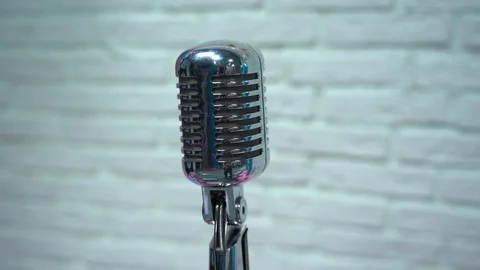 Classic microphone. Chrome mic on white background. Camera revolves around. Video stock 119978859