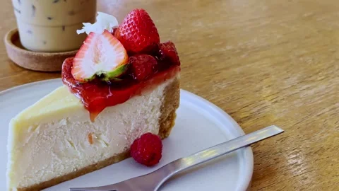 Classic New York Cheesecake Slice on White Plate Stock Footage 340413445