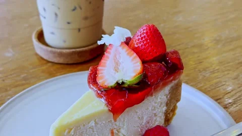 Classic New York Cheesecake Slice on White Plate Stock Footage 340413524