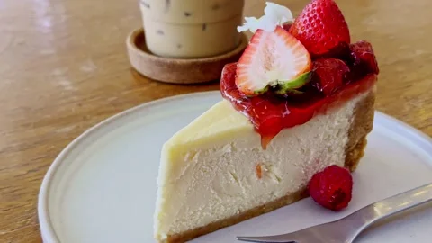 Classic New York Cheesecake Slice on White Plate Stock Footage 340413549