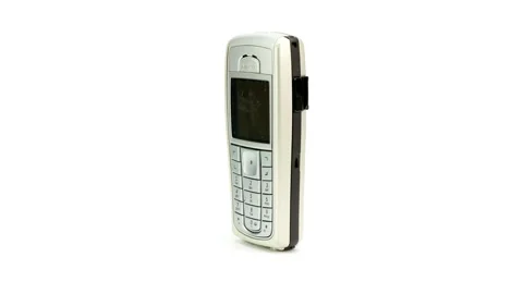 Classic nokia cell phone displaying its keypad, isolated on a white background Stock Footage 295055029