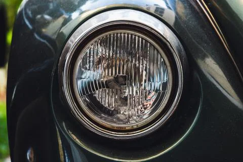 Classic old round headlight. Old timer car details Stock Photos