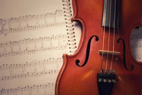 Classic old violin and notes. Stock Photos