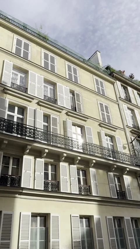 Classic Paris Apartment Facade with Sun Reflection Vertical City Scene Stock Footage 340188131