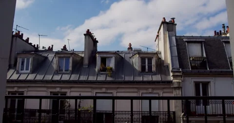 Classic Parisian Rooftops with Dormer Windows and Chimneys Stock Footage 347339378