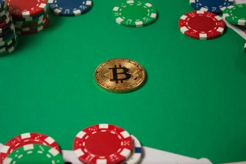 Classic playing cards, chips, red dice, bitcoin and dollars on green backgrou Stock Photos